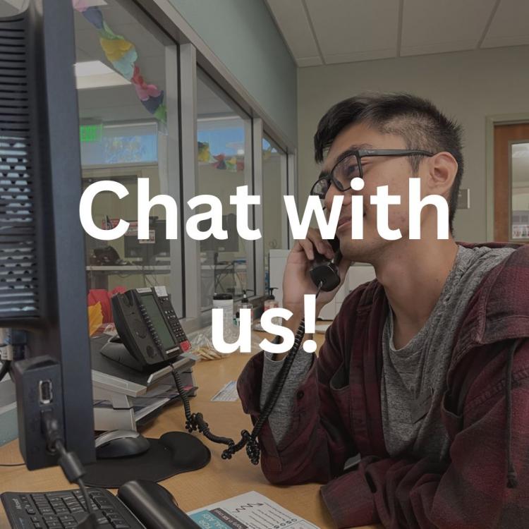 Outreach employee on phone, image says "Chat with us!"