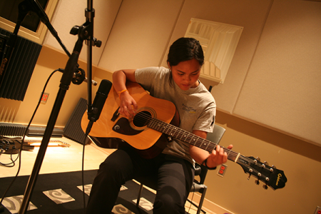 San Diego Miramar College student playing guitar.