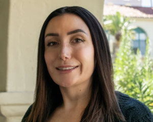 A headshot of Professor Torey Romero
